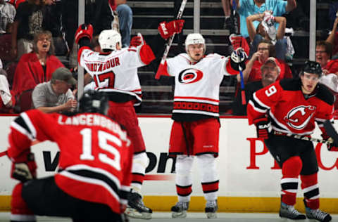 NEWARK, NJ – APRIL 28: Jussi Jokinen #36 and Rod Brind’Amour #17 of the Carolina Hurricanes celebrate Jokinen’s game-tying goal on which Brind’Amour assisted as the New Jersey Devils sport looks of dejectionat Prudential Center on April 28, 2009 in Newark, New Jersey. New Jersey defeated Carolina 4-3. (Photo by Bruce Bennett/Getty Images)