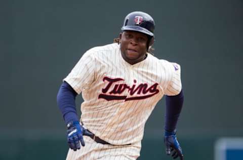 Apr 5, 2017; Minneapolis, MN, USA; Minnesota Twins third baseman Miguel Sano (22) triples in the seventh inning against the Kansas City Royals at Target Field. The Minnesota Twins beat the Kansas City Royals 9-1. Mandatory Credit: Brad Rempel-USA TODAY Sports