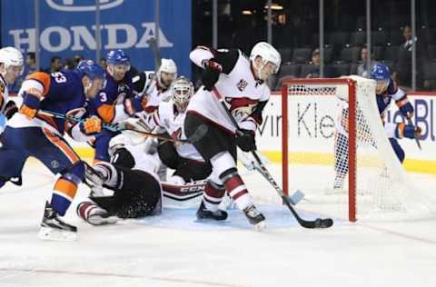 Oct 21, 2016; Brooklyn, NY, USA; Arizona Coyotes defenseman Jakob Chychrun (6) clears a puck from an empty net during the second period against New York Islanders at Barclays Center. Mandatory Credit: Anthony Gruppuso-USA TODAY Sports