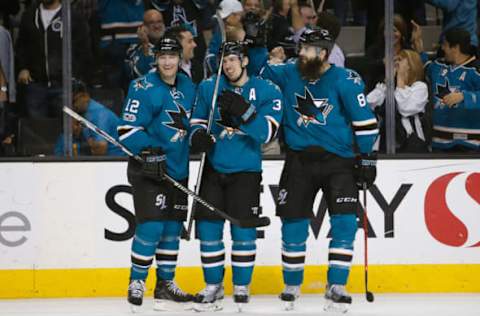 Mar 14, 2017; San Jose, CA, USA; San Jose Sharks center Logan Couture (39) celebrates with left wing Patrick Marleau (12) and defenseman Brent Burns (88) after scoring a goal against the Buffalo Sabres during the third period at SAP Center at San Jose. The Sharks defeated the Sabres 4-1. Mandatory Credit: Stan Szeto-USA TODAY Sports