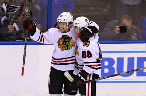 Apr 15, 2016; St. Louis, MO, USA; Chicago Blackhawks left wing Artemi Panarin (72) celebrates with Patrick Kane (88) after scoring the game-winning goal during the third period in game two of the first round of the 2016 Stanley Cup Playoffs against the St. Louis Blues at Scottrade Center. The Blackhawks won the game 3-2. Mandatory Credit: Billy Hurst-USA TODAY Sports