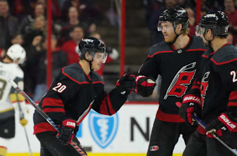 RALEIGH, NC – FEBRUARY 01: Carolina Hurricanes Center Sebastian Aho (20) is congratulated by Carolina Hurricanes Defenceman Dougie Hamilton (19) after scoring during a game between the Las Vegas Golden Knights and the Carolina Hurricanes at the PNC Arena in Raleigh, NC on February 1, 2019. (Photo by Greg Thompson/Icon Sportswire via Getty Images)