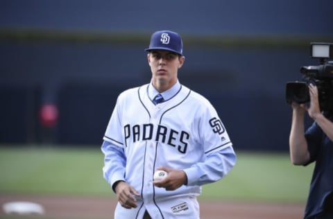 SAN DIEGO, CA – JUNE 24: San Diego Padres draft pick MacKenzie Gore throws out the first pitch before a baseball game between the Padres and the Detroit Tigers at PETCO Park on June 24, 2017 in San Diego, California. (Photo by Denis Poroy/Getty Images)