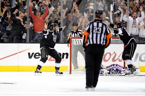 LOS ANGELES, CA – JUNE 13: Alec Martinez #27 of the Los Angeles Kings celebrates after scoring the game-winning goal in double overtime against the New York Rangers during Game Five of the 2014 Stanley Cup Final at Staples Center on June 13, 2014 in Los Angeles, California. (Photo by Harry How/Getty Images)