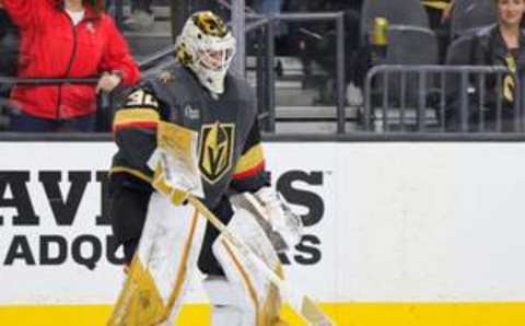 LAS VEGAS, NEVADA – MARCH 19: Jiri Patera #30 of the Vegas Golden Knights helps clean hats off the ice after his teammate Jack Eichel #9 scored a third-period goal, his third goal of the game, against the Columbus Blue Jackets at T-Mobile Arena on March 19, 2023 in Las Vegas, Nevada. The Golden Knights defeated the Blue Jackets 7-2. (Photo by Ethan Miller/Getty Images)