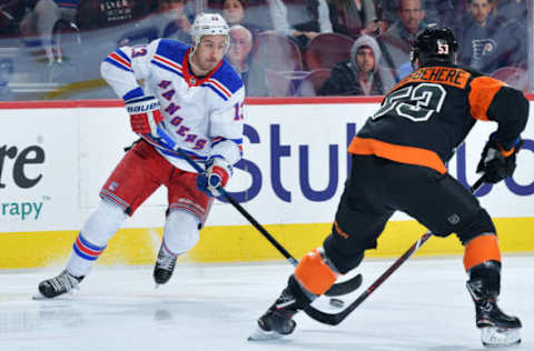 PHILADELPHIA, PENNSYLVANIA – NOVEMBER 23: Kevin Hayes #13 of the New York Rangers looks to skate past Shayne Gostisbehere #53 of the Philadelphia Flyers at Wells Fargo Center on November 23, 2018 in Philadelphia, Pennsylvania. (Photo by Drew Hallowell/Getty Images)