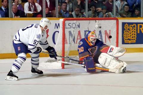 TORONTO, ON – APRIL 16: Jon Casey #30 of the St. Louis Blues skates against Doug Gilmour #93 of the Toronto Maple Leafs . (Photo by Graig Abel/Getty Images)