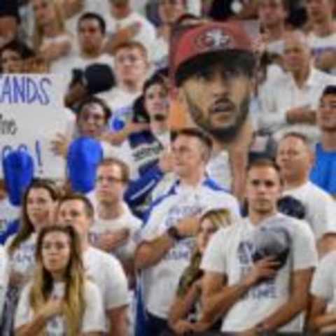 Sep 3, 2016; Glendale, AZ, USA; A fan holds up a cutout sign of San Francisco 49ers quarterback Colin Kaepernick (not pictured) during the national anthem before the game between the Arizona Wildcats and the Brigham Young Cougars at University of Phoenix Stadium. Mandatory Credit: Joe Camporeale-USA TODAY Sports