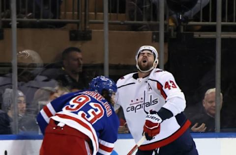 NEW YORK, NEW YORK – MARCH 14: Mika Zibanejad #93 of the New York Rangers gets the stick up on Tom Wilson #43 of the Washington Capitals during the third period at Madison Square Garden on March 14, 2023, in New York City. The Rangers defeated the Capitals 5-3. (Photo by Bruce Bennett/Getty Images)