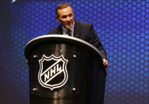 Jun 27, 2014; Philadelphia, PA, USA; Tampa Bay Lightning general manager Steve Yzerman announces Anthony Deangelo (not pictured) as the number nineteen overall pick to the Tampa Bay Lightning in the first round of the 2014 NHL Draft at Wells Fargo Center. Mandatory Credit: Bill Streicher-USA TODAY Sports