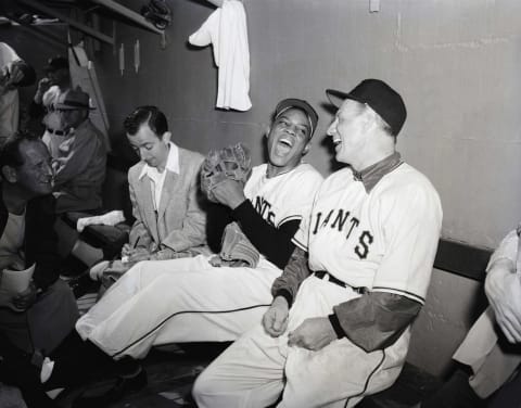 (Original Caption) 3/3/1954- Phoenix, AZ: Willy returns with a bang. Willy Mays, returning to the Giants from the army, and Manager Leo Durocher whoop it up after the outfielder pich hit a three run homer to give his side an 8-5 win during an inter squad game. The Giants will open their exhibition schedule against Cleveland at Tucson on March 6th.