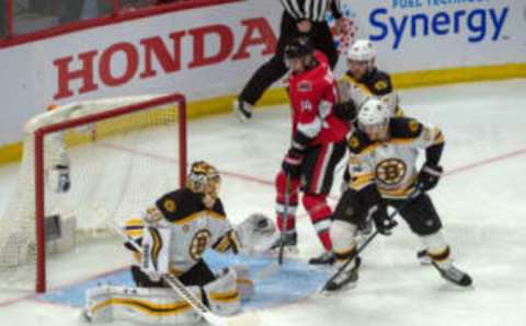 Apr 15, 2017; Ottawa, Ontario, CAN; Boston Bruins goalie Tuuka Rask (40) makes a save in front of Ottawa Senators left wing Alexandre Burrows (14) in overtime. The Senators defeated the Bruins 4-3 in game two of the first round of the 2017 Stanley Cup Playoffs at Canadian Tire Centre. Mandatory Credit: Marc DesRosiers-USA TODAY Sports