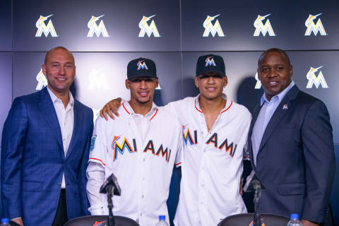 MIAMI, FL – OCTOBER 22: (L-R) Chief Executive Officer Derek Jeter of the Miami Marlins, Cuban baseball players and brothers Victor Victor Mesa, Victor Mesa Jr., and President of Baseball Operations Michael Hill meet with members of the media to announce the signing of the Mesa brothers at Marlins Park on October 22, 2018 in Miami, Florida. (Photo by Mark Brown/Getty Images)