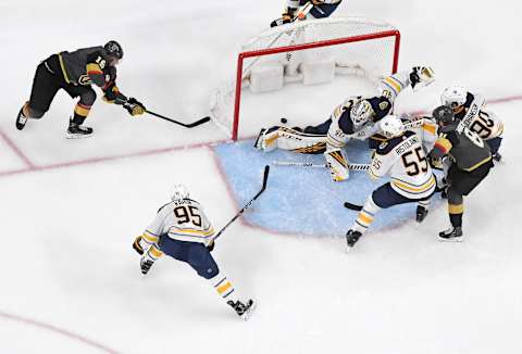 LAS VEGAS, NEVADA – FEBRUARY 28: Reilly Smith #19 of the Vegas Golden Knights scores a wraparound goal, his first of two goals in the third period, against Carter Hutton #40 of the Buffalo Sabres during their game at T-Mobile Arena on February 28, 2020 in Las Vegas, Nevada. The Golden Knights defeated the Sabres 4-2. (Photo by Ethan Miller/Getty Images)