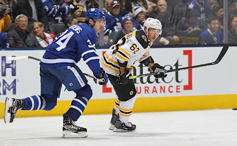 TORONTO, ON – OCTOBER 19: Brad Marchand #63 of the Boston Bruins skates against Auston Matthews #34 of the Toronto Maple Leafs during an NHL game at Scotiabank Arena on October 19, 2019 in Toronto, Ontario, Canada. The Maple Leafs defeated the Bruins 4-3 in overtime. (Photo by Claus Andersen/Getty Images)