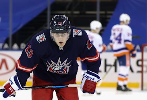 Adam Fox #23 of the New York Rangers leaves the ice