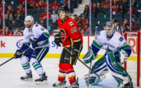 Sep 30, 2016; Calgary, Alberta, CAN; Calgary Flames left wing Matthew Tkachuk (19) screens in front of Vancouver Canucks goalie Thatcher Demko (35) during a preseason hockey game at Scotiabank Saddledome. Calgary Flames won 2-1. Mandatory Credit: Sergei Belski-USA TODAY Sports