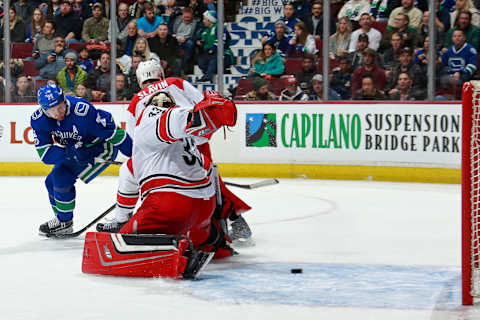 VANCOUVER, BC – DECEMBER 5: Daniel Sedin #22 of the Vancouver Canucks looks on as a loose puck passes Scott Darling #33 of the Carolina Hurricanes during their NHL game at Rogers Arena December 5, 2017 in Vancouver, British Columbia, Canada. (Photo by Jeff Vinnick/NHLI via Getty Images)