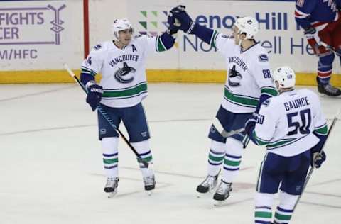 Nov 8, 2016; New York, NY, USA; Vancouver Canucks right wing Alexandre Burrows (14) celebrates scoring during the third period against the New York Rangers at Madison Square Garden. The Canucks won 5-3. Mandatory Credit: Anthony Gruppuso-USA TODAY Sports