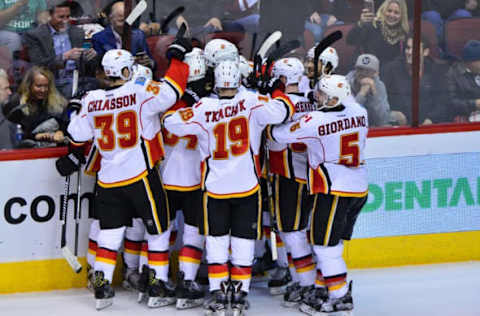 Dec 8, 2016; Glendale, AZ, USA; The Calgary Flames celebrate after defeating the Arizona Coyotes 2-1 ion overtime at Gila River Arena. Mandatory Credit: Matt Kartozian-USA TODAY Sports