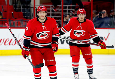 The Carolina Hurricanes’ Valentin Zykov, left, skates back to the bench with Teuvo Teravainen (86) after he scored during the first period against the Arizona Coyotes at PNC Arena in Raleigh, N.C., on Thursday, March 22, 2018. The Canes won, 6-5. (Chris Seward/Raleigh News