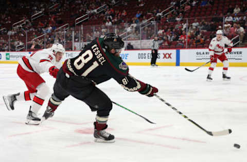 GLENDALE, ARIZONA – APRIL 18: Phil Kessel #81 of the Arizona Coyotes shoots the puck ahead of Brady Skjei #76 of the Carolina Hurricanes during the second period of the NHL game at Gila River Arena on April 18, 2022, in Glendale, Arizona. (Photo by Christian Petersen/Getty Images)