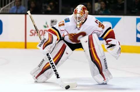 NHL Power Rankings: Calgary Flames goalie Chad Johnson (31) deflects the puck against the San Jose Sharks in the first period at SAP Center at San Jose. Mandatory Credit: John Hefti-USA TODAY Sports