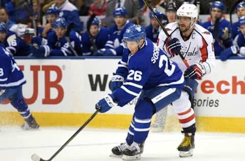 Nov 26, 2016; Toronto, Ontario, CAN; Toronto Maple Leafs forward Nikita Soshnikov (26) skates the puck past Washington Capitals forward Alex Ovechkin (8) in the third period at Air Canada Centre. Mandatory Credit: Dan Hamilton-USA TODAY Sports