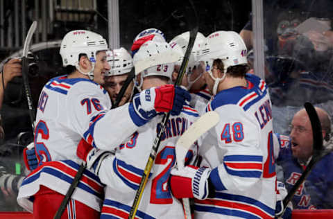 NEWARK, NEW JERSEY – APRIL 01: Brett Howden #21 of the New York Rangers is congratulated after he scored a goal in the first period against the New Jersey Devils at Prudential Center on April 01, 2019 in Newark, New Jersey. (Photo by Elsa/Getty Images)