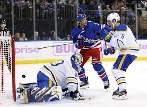 NEW YORK, NEW YORK – NOVEMBER 21: Ryan Reaves #75 of the New York Rangers celebrates teammate K’Andre Miller’s goal as Aaron Dell #80 and Robert Hagg #8 of the Buffalo Sabres defend in the second period at Madison Square Garden on November 21, 2021 in New York City. (Photo by Elsa/Getty Images)