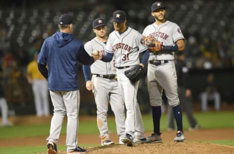 OAKLAND, CA – JUNE 12: Manager AJ Hinch #14 of the Houston Astros takes the ball from pitcher Collin McHugh #31 taking McHugh out of the game against the Oakland Athletics in the bottom of the eighth inning at the Oakland Alameda Coliseum on June 12, 2018 in Oakland, California. (Photo by Thearon W. Henderson/Getty Images)