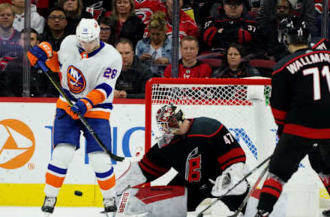 RALEIGH, NC – JANUARY 19: James Reimer #47 of the Carolina Hurricanes makes the save as Michael Dal Colle #28 of the New York Islanders attempts to create traffic during an NHL game on January 19, 2020 at PNC Arena in Raleigh, North Carolina. (Photo by Gregg Forwerck/NHLI via Getty Images)