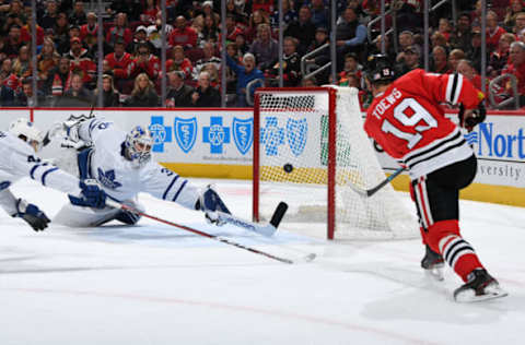 CHICAGO, IL – NOVEMBER 10: Jonathan Toews #19 of the Chicago Blackhawks scores on goalie Michael Hutchinson #30 of the Toronto Maple Leafs in the first period at the United Center on November 10, 2019 in Chicago, Illinois. (Photo by Bill Smith/NHLI via Getty Images)