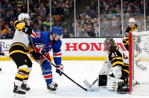 BOSTON, MA – MARCH 27: Boston Bruins goalie Jaroslav Halak (41) makes a save with New York Rangers center Lias Andersson (50) in front during a game between the Boston Bruins and the New York Rangers on March 27, 2019, at TD Garden in Boston, Massachusetts. (Photo by Fred Kfoury III/Icon Sportswire via Getty Images)