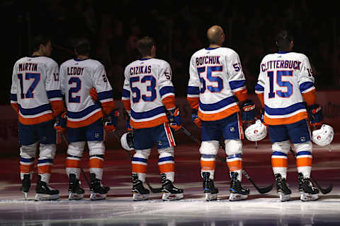 Matt Martin #17, Casey Cizikas #53, and Cal Clutterbuck #15 of the New York Islanders. (Photo by Christian Petersen/Getty Images)