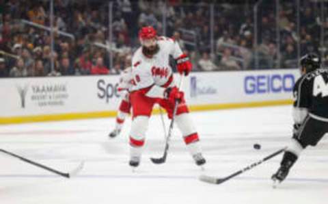 Oct 14, 2023; Los Angeles, California, USA; Carolina Hurricanes Defensemen Brent Burns (8) makes a play against Los Angeles Kings Center Blake Lizotte (46) during the third period at Crypto.com Arena. Mandatory Credit: Yannick Peterhans-USA TODAY Sports