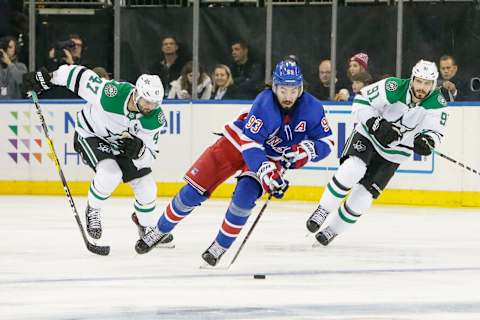 NEW YORK, NY – NOVEMBER 19: New York Rangers center Mika Zibanejad (93) skates with puck as Dallas Stars right wing Alexander Radulov (47) and Dallas Stars center Tyler Seguin (91) trail the play during the Dallas Stars and New York Rangers NHL game on November 19, 2018, at Madison Square Garden in New York, NY. (Photo by John Crouch/Icon Sportswire via Getty Images)