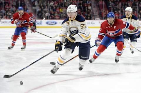 Mar 10, 2016; Montreal, Quebec, CAN; Buffalo Sabres defenseman Rasmus Ristolainen (55) plays the puck as Montreal Canadiens forward Max Pacioretty (67) defends during the first period at the Bell Centre. Mandatory Credit: Eric Bolte-USA TODAY Sports