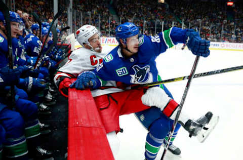 VANCOUVER, BC – DECEMBER 12: Jay Beagle #83 of the Vancouver Canucks checks Trevor van Riemsdyk #57 of the Carolina Hurricanes during their NHL game at Rogers Arena December 12, 2019 in Vancouver, British Columbia, Canada. (Photo by Jeff Vinnick/NHLI via Getty Images)