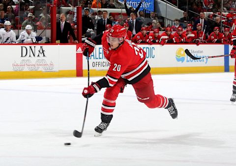 RALEIGH, NC – APRIL 7: Sebastian Aho #20 of the Carolina Hurricanes shoots the puck during an NHL game against the Tampa Bay Lightning on April 7, 2018 at PNC Arena in Raleigh, North Carolina. (Photo by Gregg Forwerck/NHLI via Getty Images)