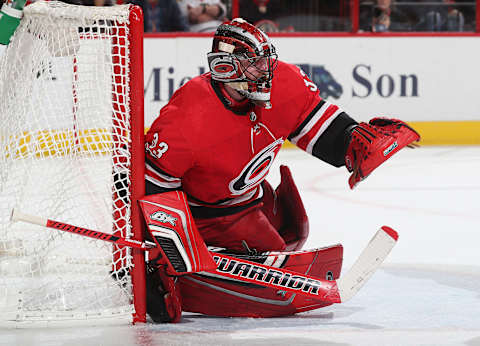 RALEIGH, NC – NOVEMBER 11: Scott Darling #33 of the Carolina Hurricanes goes down in the crease and directs traffic during an NHL game against the Chicago Blackhawks on November 11, 2017 at PNC Arena in Raleigh, North Carolina. (Photo by Gregg Forwerck/NHLI via Getty Images)