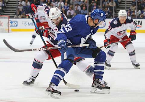 TORONTO, ON – OCTOBER 21: Nick Foligno #71 of the Columbus Blue Jackets steals the puck from Cody Ceci #83 of the Toronto Maple Leafs . (Photo by Claus Andersen/Getty Images).