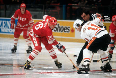 NEW YORK – CIRCA 1979: Vladimir Petrov #16 of the Soviet Union National hockey team faces off against Gilber Perreault #11 of the NHL All Stars during the 1979 Challenge Cup Trophy circa February 1979 at Madison Square Garden in the Manhattan borough of New York City. The Soviets defeated the NHL 2 games to 1. (Photo by Focus on Sport/Getty Images)