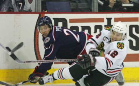 COLUMBUS, OH – MARCH 26: Alexandre Picard #21 of the Columbus Blue Jackets knocks down Jordan Hendry #42 of the Chicago Blackhawks as he gets the shot off on March 26, 2008 at the Nationwide Arena in Columbus, Ohio. (Photo by Bruce Bennett/Getty Images)