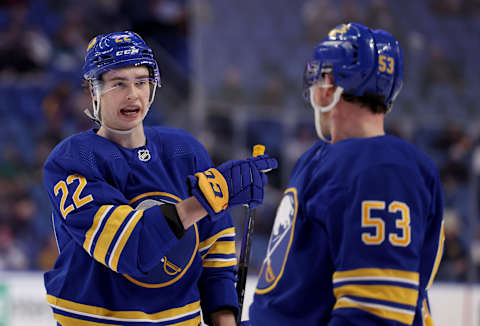 Jan 20, 2022; Buffalo, New York, USA; Buffalo Sabres right wing Jack Quinn (22) talks with left wing Jeff Skinner (53) during a stoppage in play against the Dallas Stars during the second period at KeyBank Center. Mandatory Credit: Timothy T. Ludwig-USA TODAY Sports