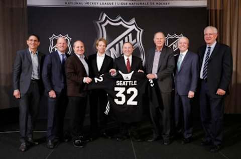 SEA ISLAND, GA – DECEMBER 04: (L to R) Adrian Hanauer, NHL Seattle franchise Vice-Chairman David Wright, Jay Deutsch, Jerry Bruckheimer, NHL Commissioner Gary Bettman, NHL Seattle franchise majority owner David Bonderman, Len Potter, and NHL Seattle franchise President and CEO Tod Leiweke pose for a photo during the NHL Board of Governors Meeting on December 4, 2018 in Sea Island, Georgia. The NHL Board of Governors approved expanding to Seattle, making the franchise the 32nd team in the league. (Photo by Patrick McDermott/NHLI via Getty Images)