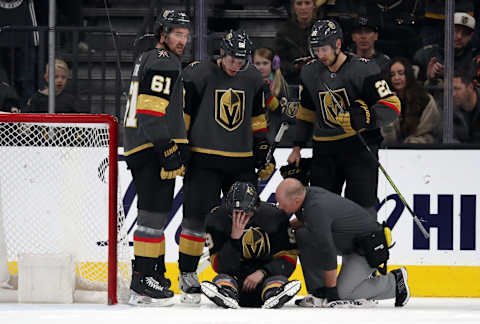 LAS VEGAS, NEVADA – JANUARY 04: Cody Glass #9 of the Vegas Golden Knights is helped off the ice after suffering an injury during the third period against the St. Louis Blues at T-Mobile Arena on January 04, 2020 in Las Vegas, Nevada. (Photo by Zak Krill/NHLI via Getty Images)