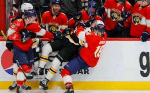 Apr 21, 2023; Sunrise, Florida, USA; Florida Panthers center Aleksander Barkov (16) and Boston Bruins defenseman Charlie McAvoy (73) fight during the third period in game three of the first round of the 2023 Stanley Cup Playoffs at FLA Live Arena. Mandatory Credit: Sam Navarro-USA TODAY Sports