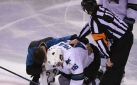 Mar 29, 2016; Vancouver, British Columbia, CAN; San Jose Sharks forward Nick Spaling (16) lays on the ice after being injured by Vancouver Canucks forward Jake Virtanen (not pictured) during the second period at Rogers Arena. Mandatory Credit: Anne-Marie Sorvin-USA TODAY Sports