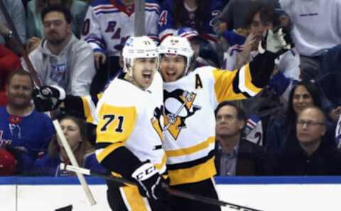 NEW YORK, NEW YORK – MAY 11: Kris Letang #58 of the Pittsburgh Penguins (R) celebrates his second period goal against the New York Rangers and is joined by Evgeni Malkin #71 (L) in Game Five of the First Round of the 2022 Stanley Cup Playoffs at Madison Square Garden on May 11, 2022 in New York City. (Photo by Bruce Bennett/Getty Images)